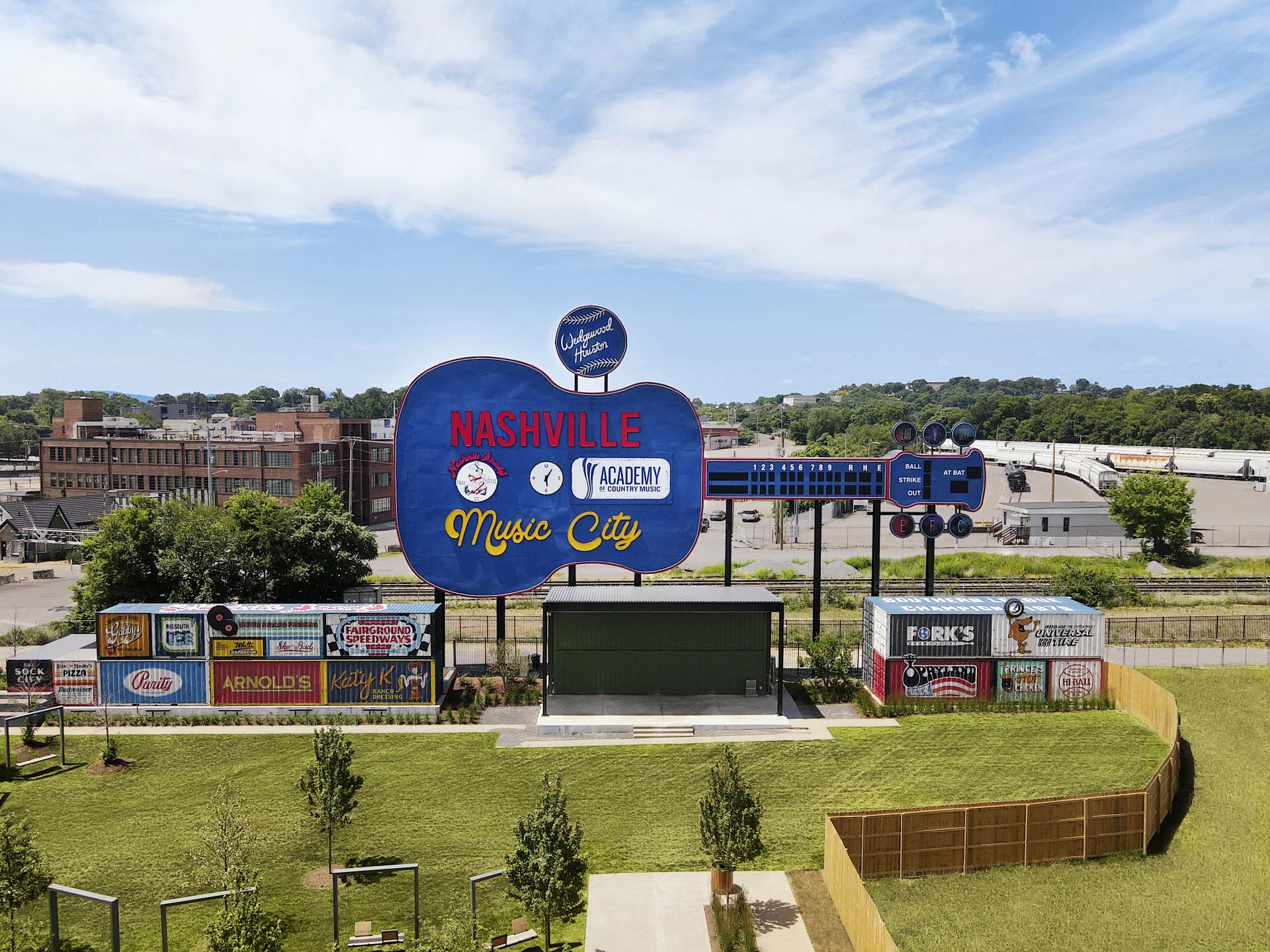 In partnership with Studio Delger, Jarvis Signs, and I Saw the Sign, the Greer Guitar was reimagined. The scoreboard sits above 14 shipping containers painted to resemble the original advertisements at Greer Stadium